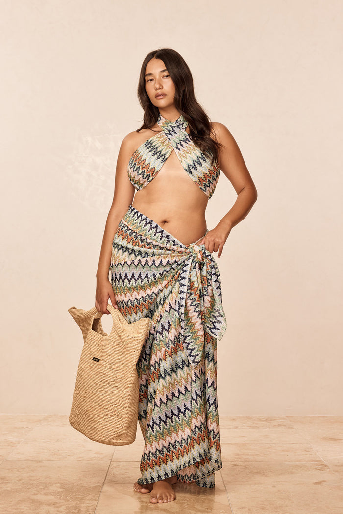 Front view of Ramatuelle Top in Porto Cervo Multi on model, halter crossover neckline and multicolor zigzag knit, neutral background