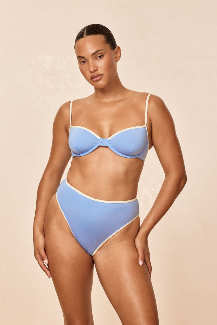 Front of Capri Color Block Top in Azure/Ivory with underwire, ivory contrast trim and thin straps on beige background
