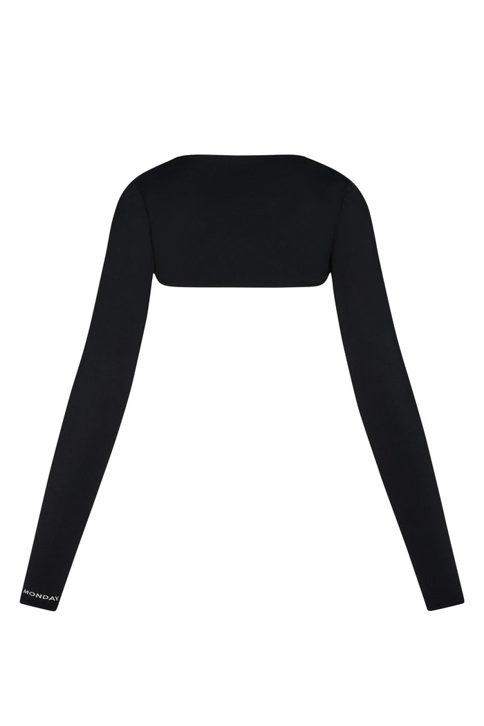 Back view of black Runyon Canyon Bolero showing cropped back, long fitted sleeves with thumbholes and MONDAY logo on cuff on white background