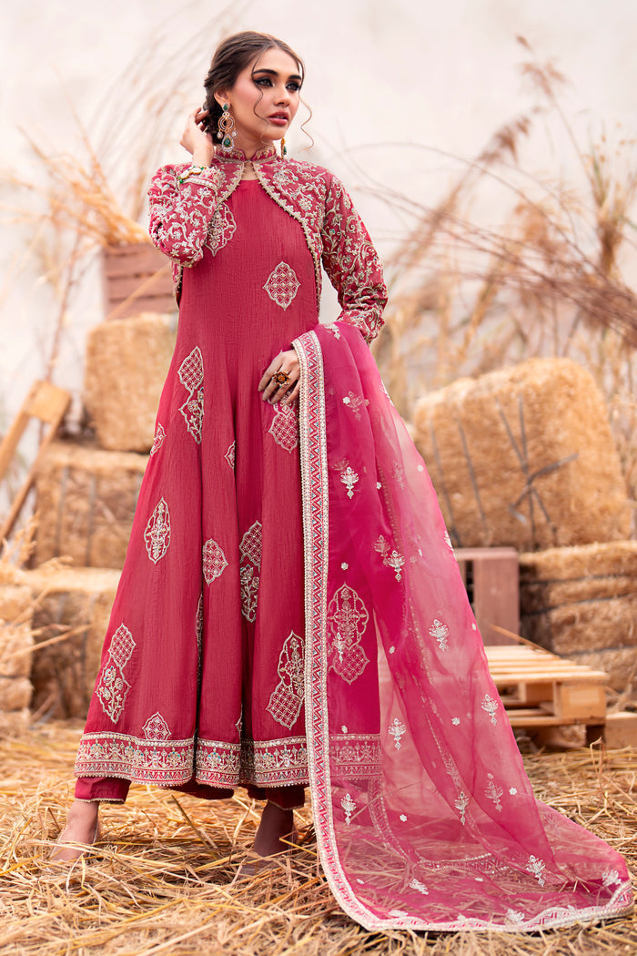 Side view of Naqshi Samar showcasing the open jacket’s sleeve crystals, curved jall embroidery, frock cutline, and straight trouser silhouette.