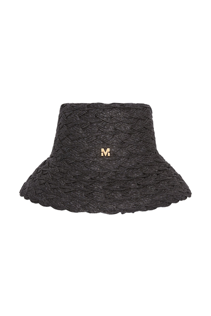 Black braided straw bucket hat with scalloped brim and small gold 'M' logo on crown.