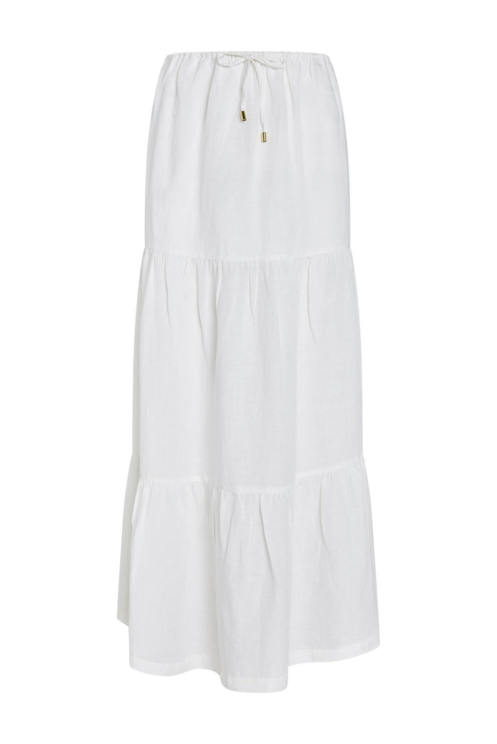 Front view of San Sebastian skirt in white showing tiered maxi and drawstring waist with gold tone aglets