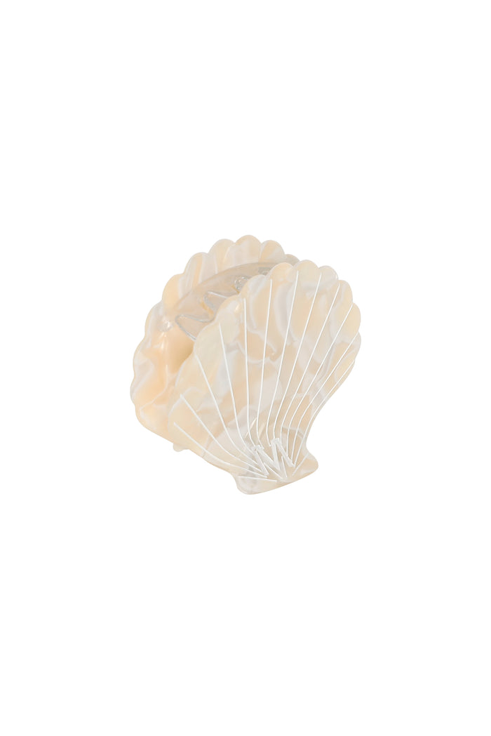 Pearlized cream shell-shaped hair claw clip with scalloped edges