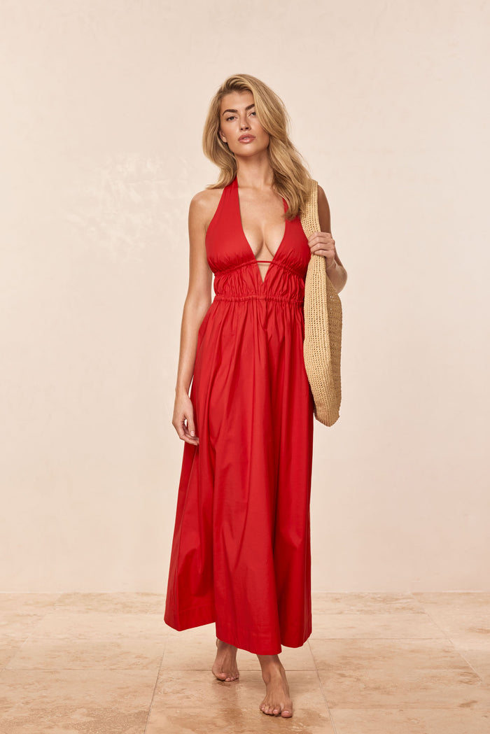 Front view of Santa Cruz Dress in Chili Pepper on model showing plunging halter V-neck and ankle-length silhouette