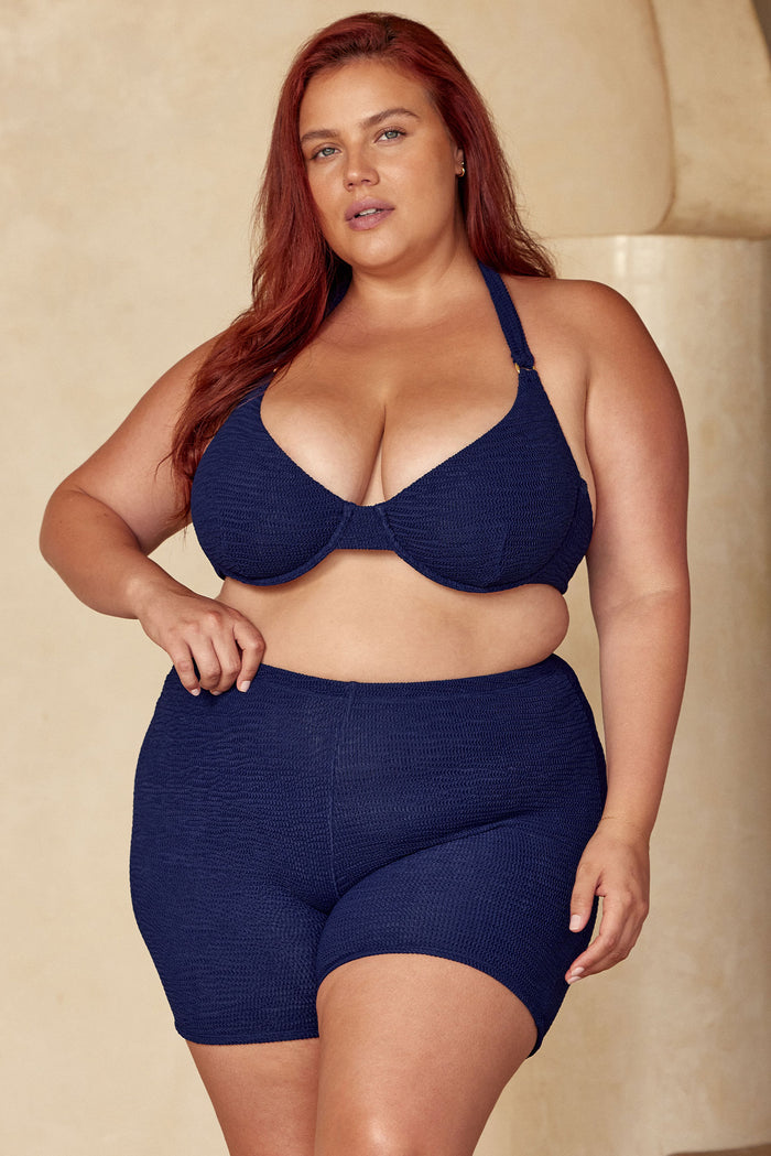 Front view of Santa Cruz Short in Midnight Crinkle on model, textured high-waist mid-thigh swim shorts against neutral background
