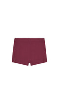 Flat lay of Santa Cruz kids shorts showcasing fig crinkle textured fabric on white background
