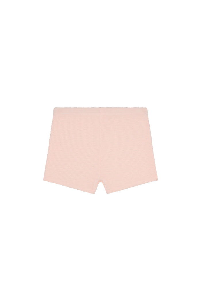 Front view of Santa Cruz kids shorts in powder pink crinkle showcasing crinkled textured fabric and elastic waist on white background