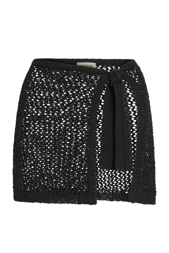 Front view of Santa Marta Sarong in black showing open-weave crochet, side wrap tie, unlined sheer finish on white background