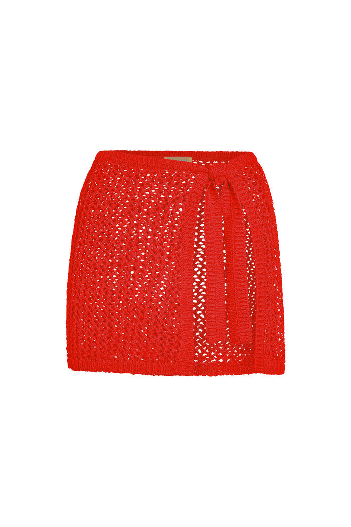 Front view of Santa Marta Sarong in Chili Pepper showing petit crochet open-knit fabric and side tie on white background