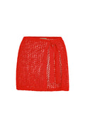 Front view of Santa Marta Sarong in Chili Pepper showing petit crochet open-knit fabric and side tie on white background