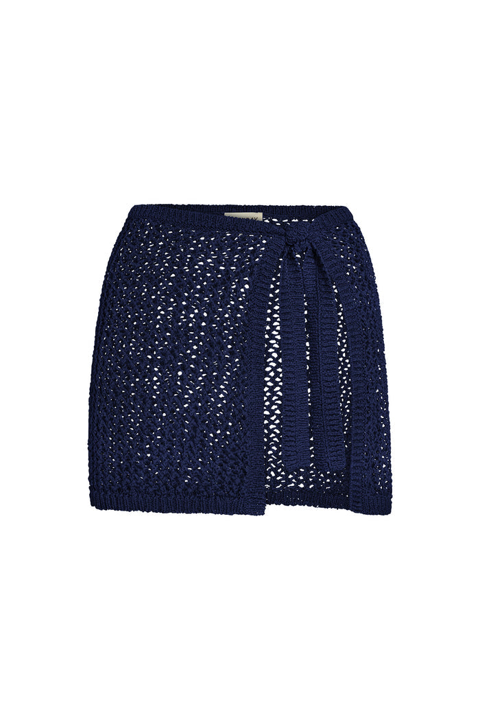 Front view of Santa Marta sarong in midnight navy petit crochet showing open-knit texture and tie-waist detail on white background