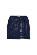 Front view of Santa Marta sarong in midnight navy petit crochet showing open-knit texture and tie-waist detail on white background