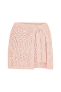 Front view of Santa Marta sarong in powder pink petit crochet showing side tie and open crochet knit on white background