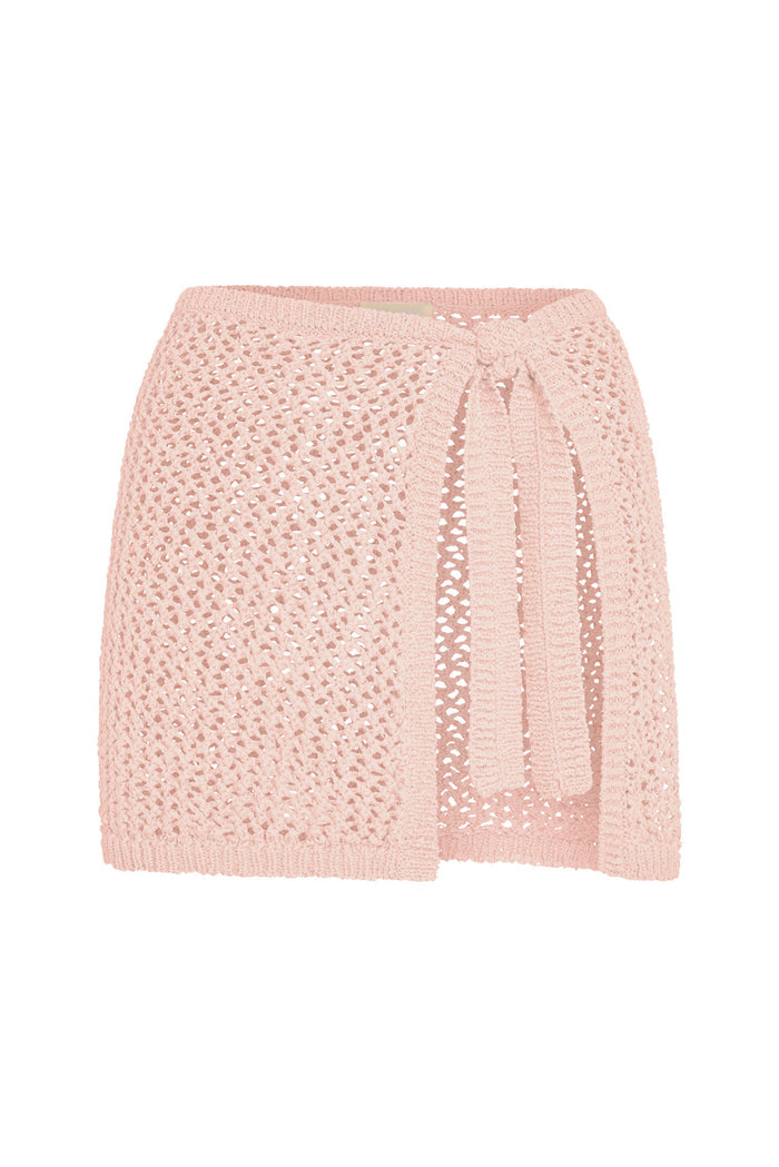 Front view of Santa Marta sarong in powder pink petit crochet showing side tie and open crochet knit on white background