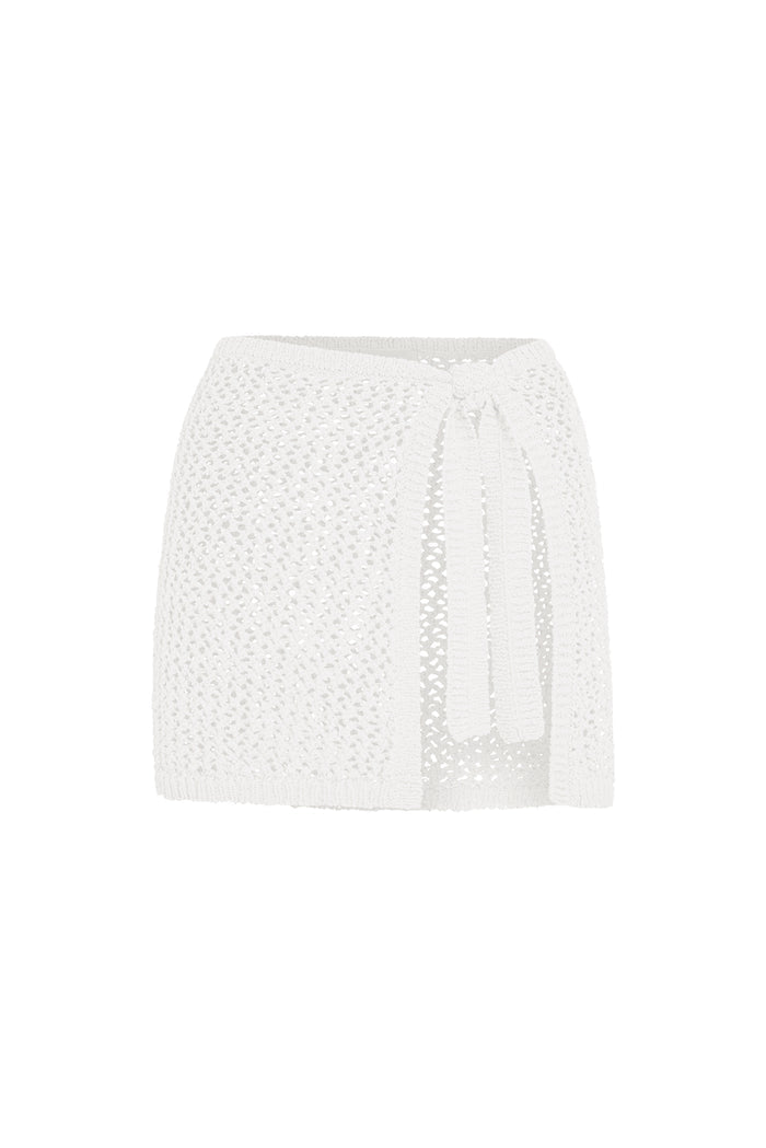 Front view of Santa Marta Sarong in white petit crochet, open knit wrap skirt with adjustable tie on white background
