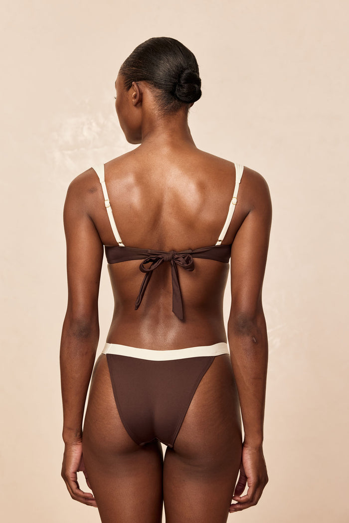 Back view of Santorini Bottom Espresso/Ivory showing ivory waistband, high-cut mid-waist cheeky coverage, beige background