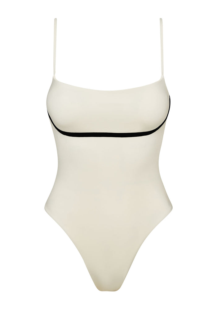 Women's one-piece cream swimsuit with thin spaghetti straps and black underbust trim