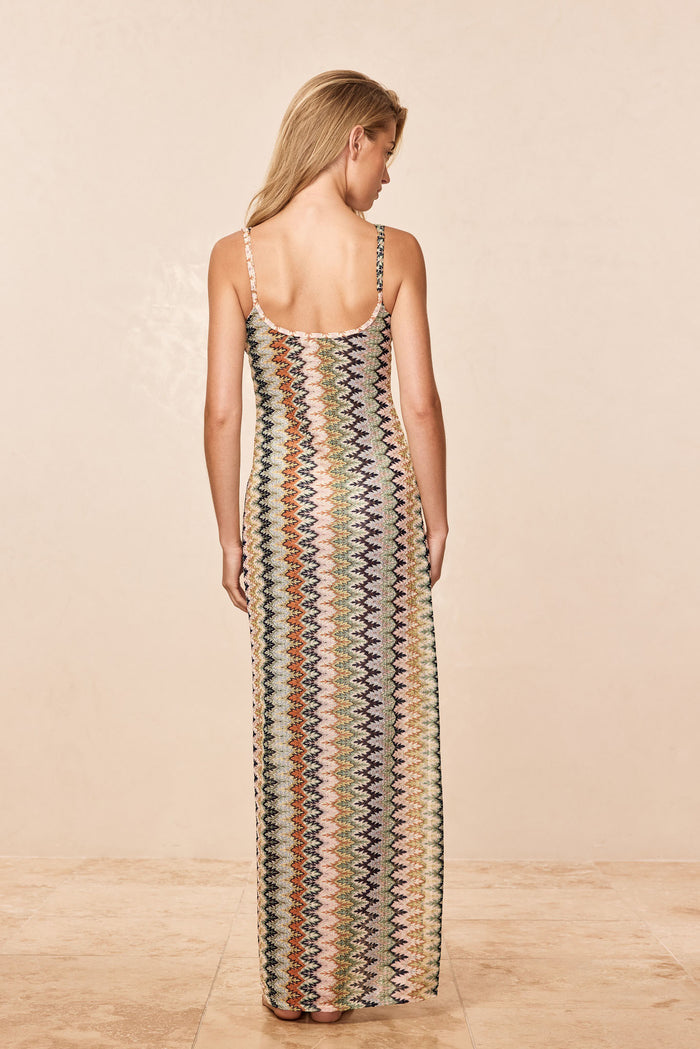 Back view of Sayulita Dress in Porto Cervo Multi, crochet knit with low scoop back and adjustable straps on neutral backdrop