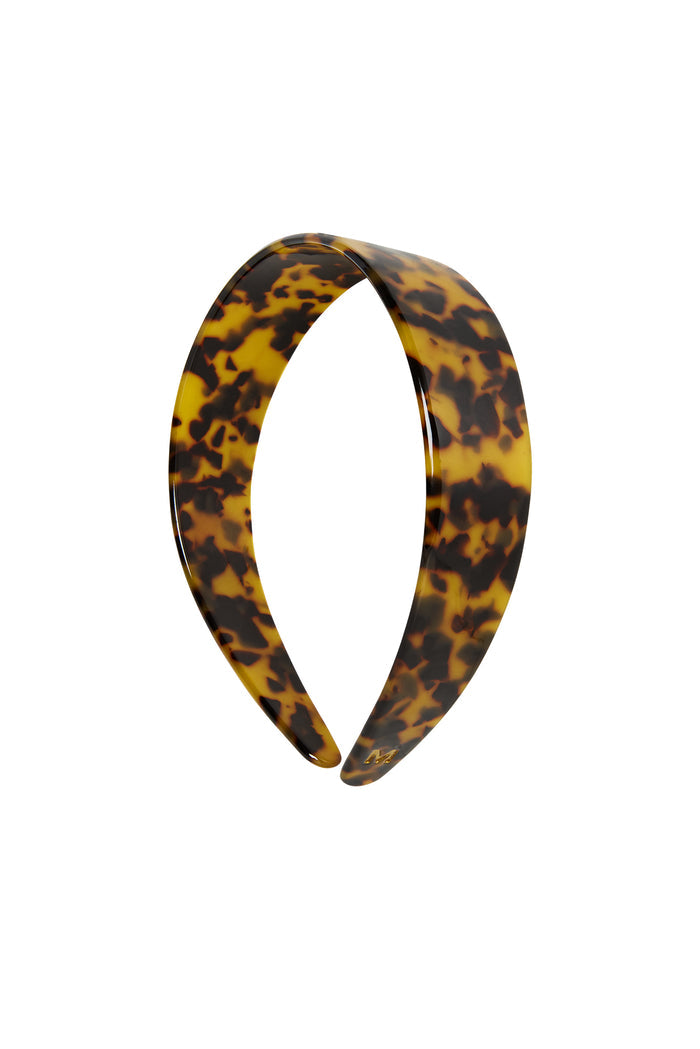 Front view of Sayulita Headband in Tortoise showcasing wide marbled acetate band and engraved gold M logo on white background