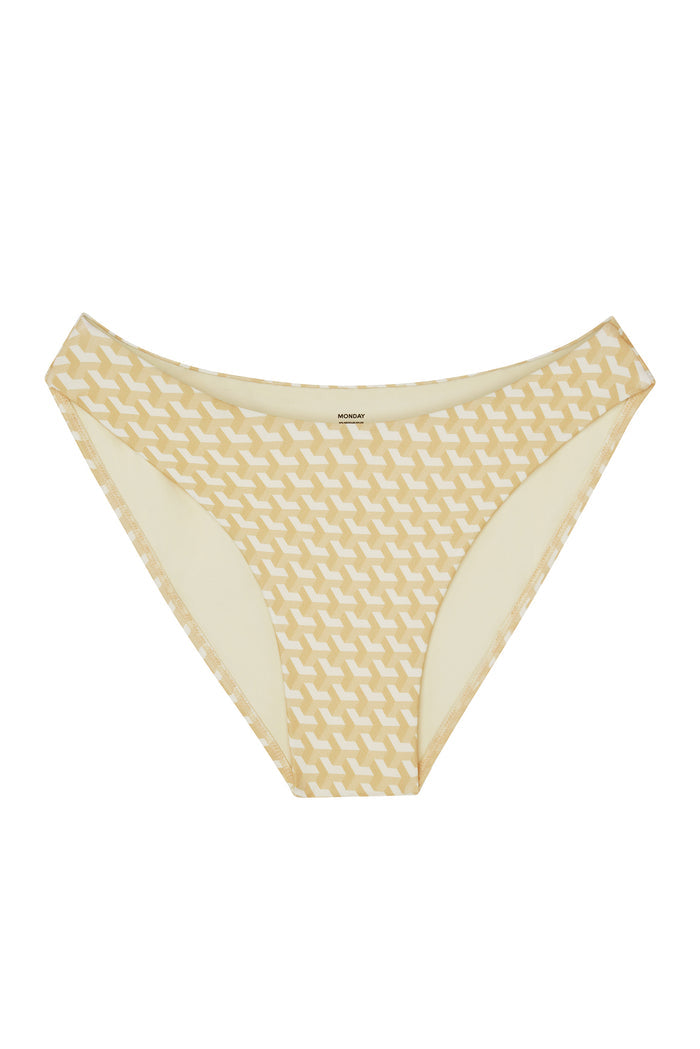 Close-up front of Seychelles Bottom in Ivory Geo showing ivory geometric pattern and MONDAY inner waistband on white background