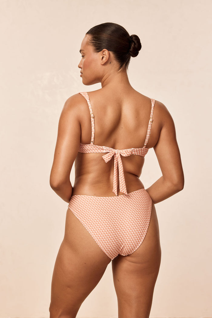 Rear view of Seychelles Bottom Micro Geo showing moderate coverage, high cut leg and textured micro geo print on beige background