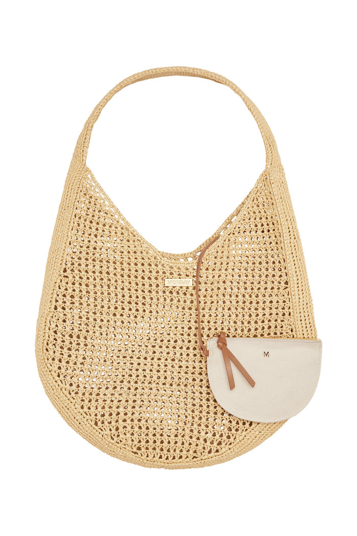Top close-up of Shell Beach Bag in Natural showing woven texture, wide shoulder strap and mini pouch on white