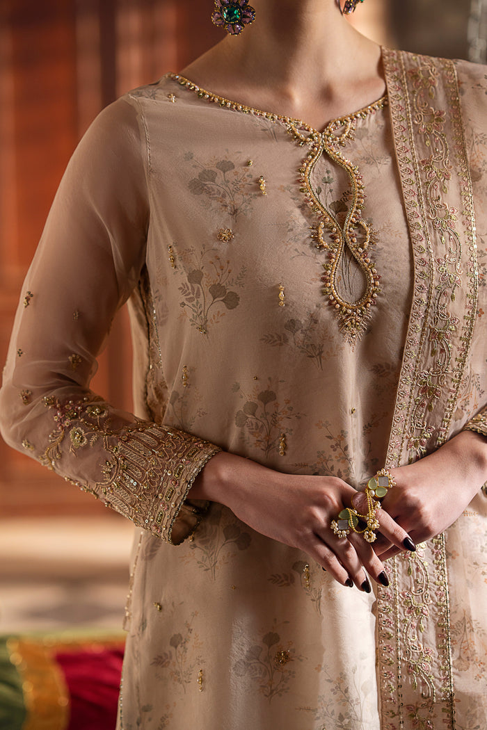 Close detail of NAQSHI Shifa beige shirt showing boat neckline with embroidery, sequins, and refined adda work.
