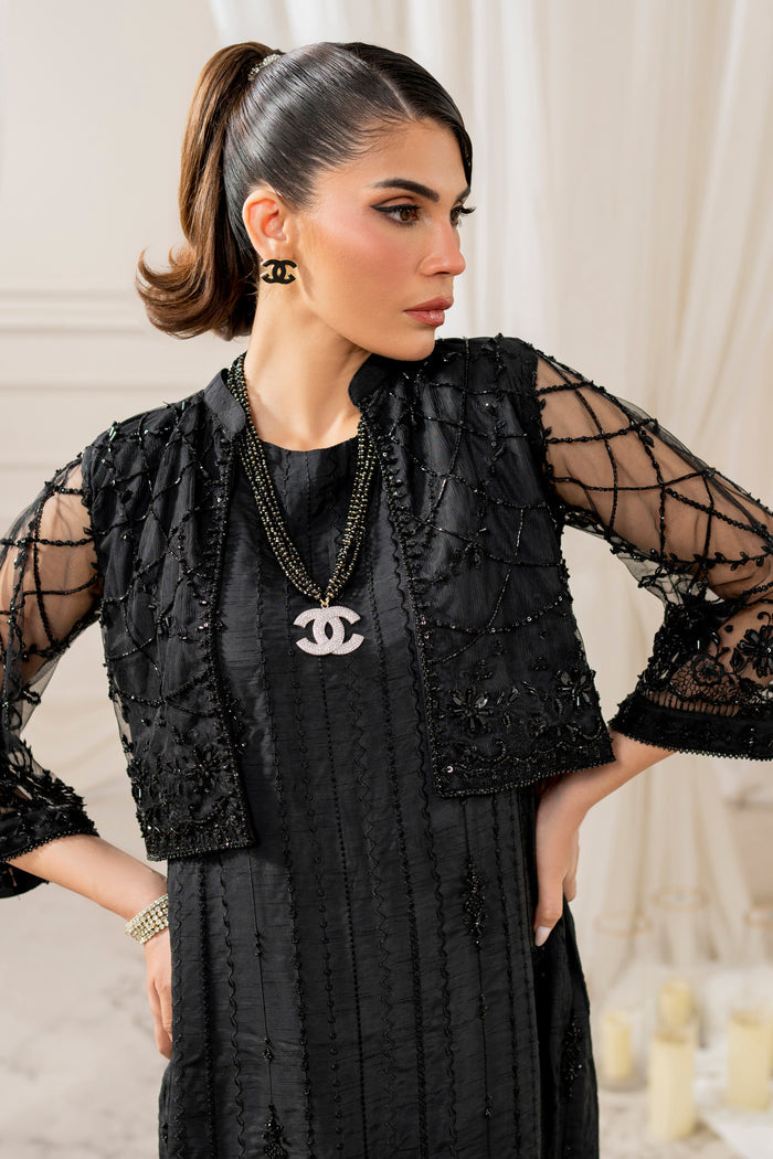 Front view of naqshi siara straight raw‑silk pants in black, showcasing clean lines and pairing elegantly with embroidered shirt.