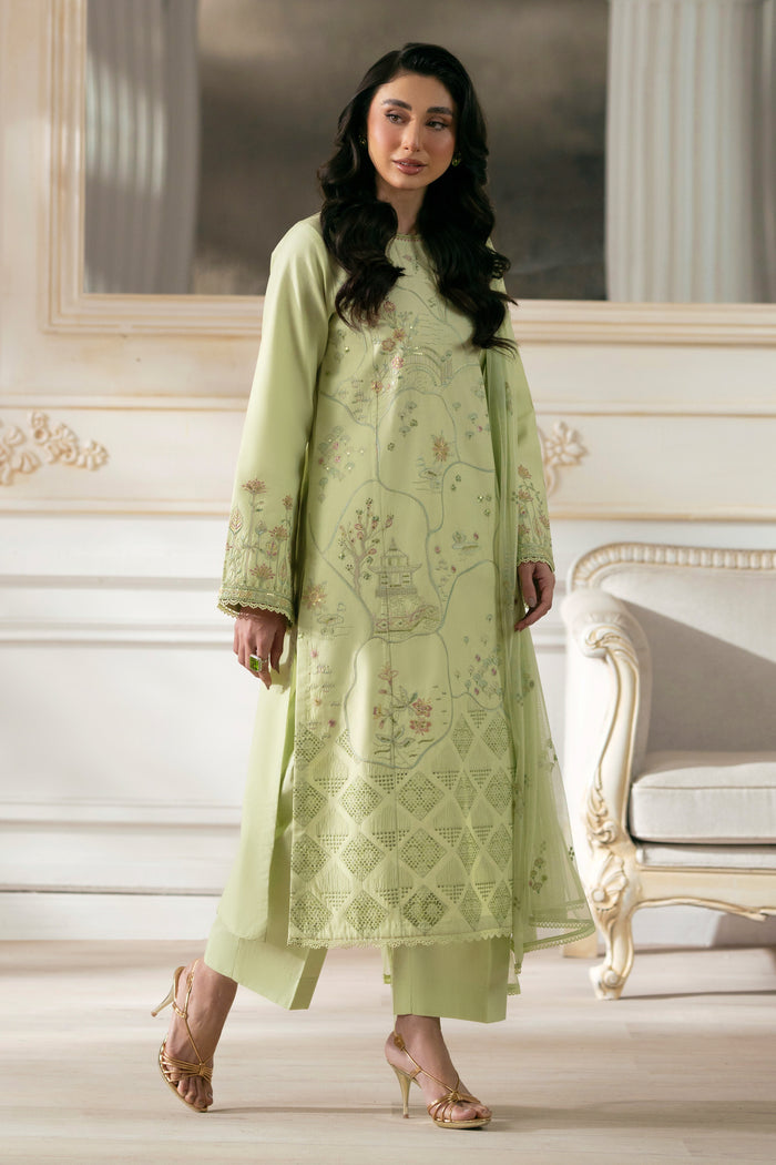 Side view of NAQSHI Sitara showcasing straight cambric shirt with lace and sequin‑trim sleeves, revealing clean silhouette with matching straight pants.