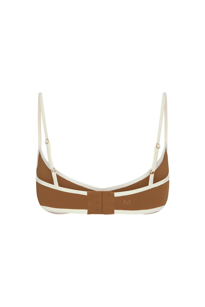 Back view of Soho Bra in caramel and ivory showcasing adjustable straps, three-hook back closure, and color-block trim on white background