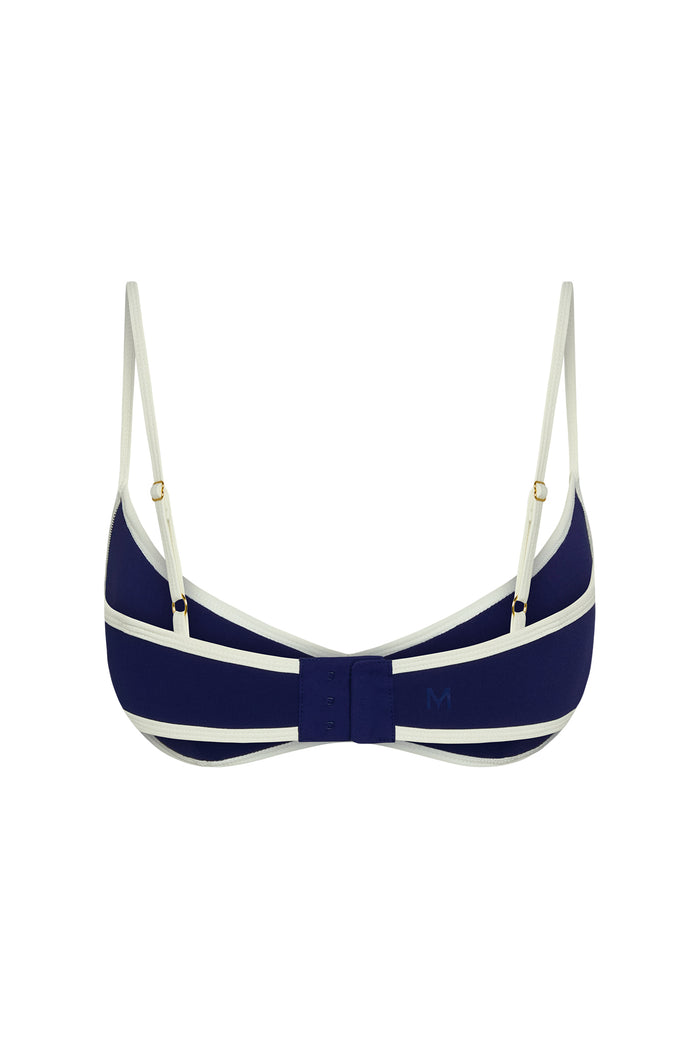 Back view of Soho Bra in Midnight/Ivory showing adjustable straps, three-hook back closure and colorblock trim on white