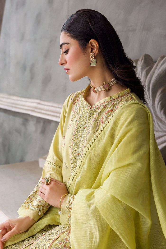 Close side portrait showing Sophie gown sleeve embroidery, lace trim and tassel detail