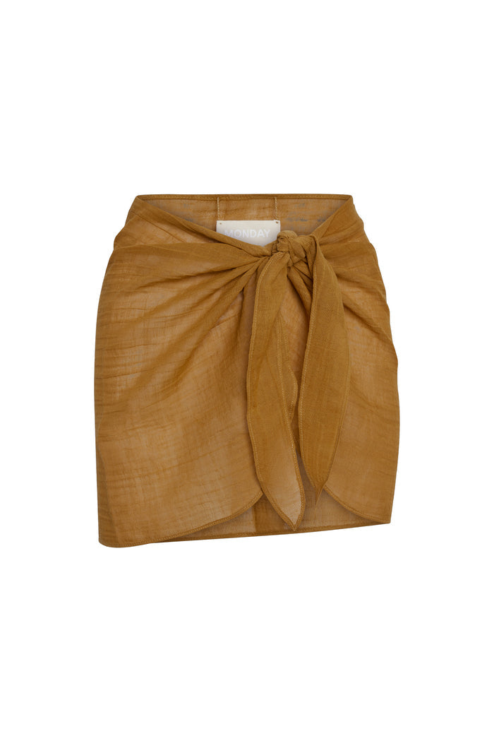 Front view of South Beach Sarong showcasing adjustable tie-front knot, rounded hem and semi-sheer linen on white background
