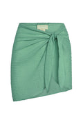 Front view of South Beach Sarong in pond crinkle linen showcasing crinkle texture, front tie knot and rounded hem on white