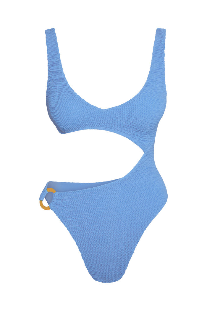 Light blue textured one-piece swimsuit with asymmetric cutout and amber ring detail on left hip