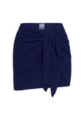 Cropped front view of St. Barth’s Skirt in Midnight Crinkle showing navy crinkle-knit sarong wrap with front tie on white background