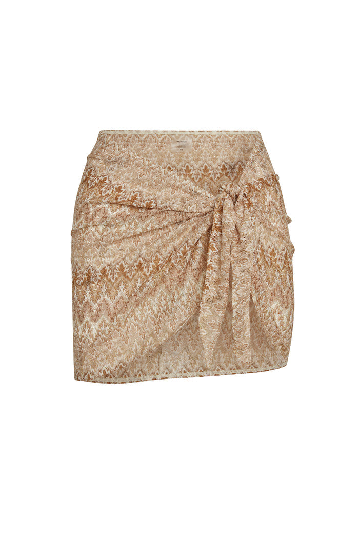 Front view of St. Barth's Skirt in Porto Cervo Gold showcasing wrap-tie waist and textured gold pattern on white background
