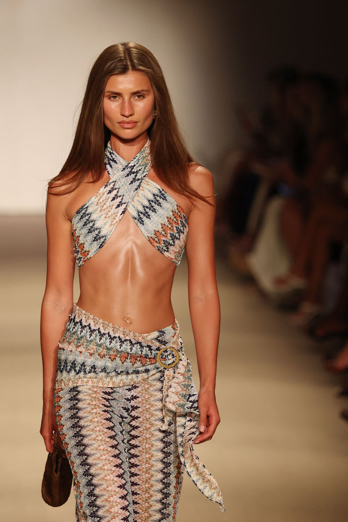Front view of St. Barth’s Skirt Porto Cervo Multi on model showcasing textured zigzag knit wrap with side ring on runway