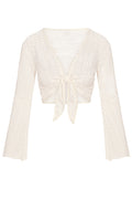 Front view of St. Barth's top in ivory crochet, tie-front cropped knit with long bell sleeves on white background