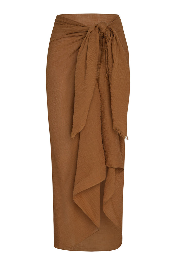 Front view of St. Tropez sarong in caramel crinkle linen showcasing tied knot waist and cascading drape on white background