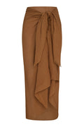 Front view of St. Tropez sarong in caramel crinkle linen showcasing tied knot waist and cascading drape on white background