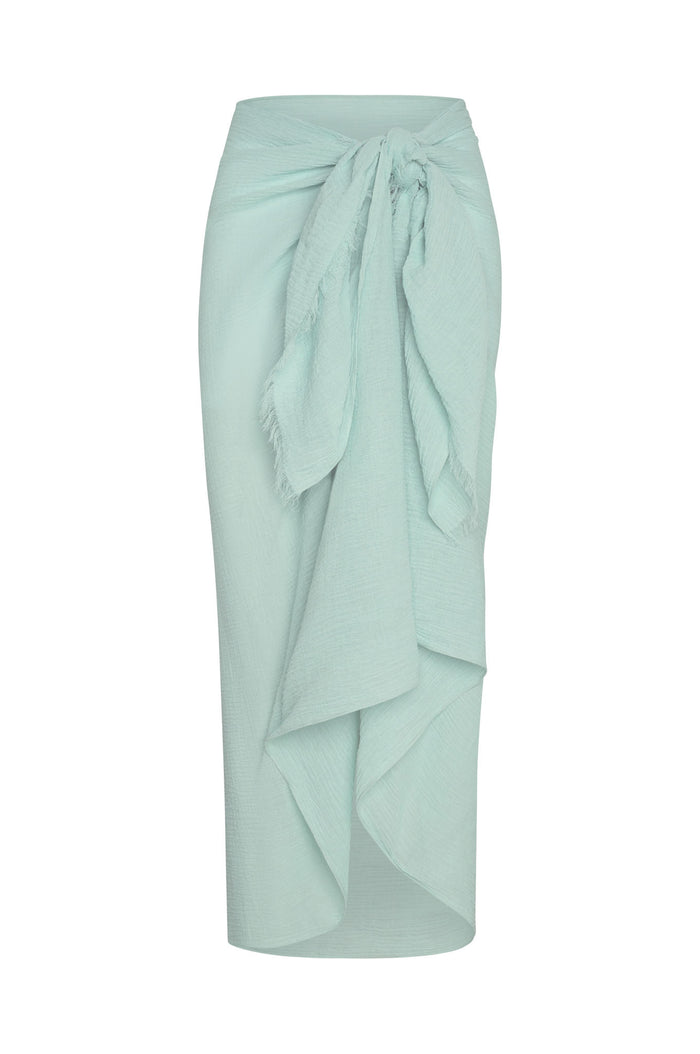 Front view of St. Tropez Sarong in light slate crinkle linen showcasing tied waist knot and draped ruffle on white background