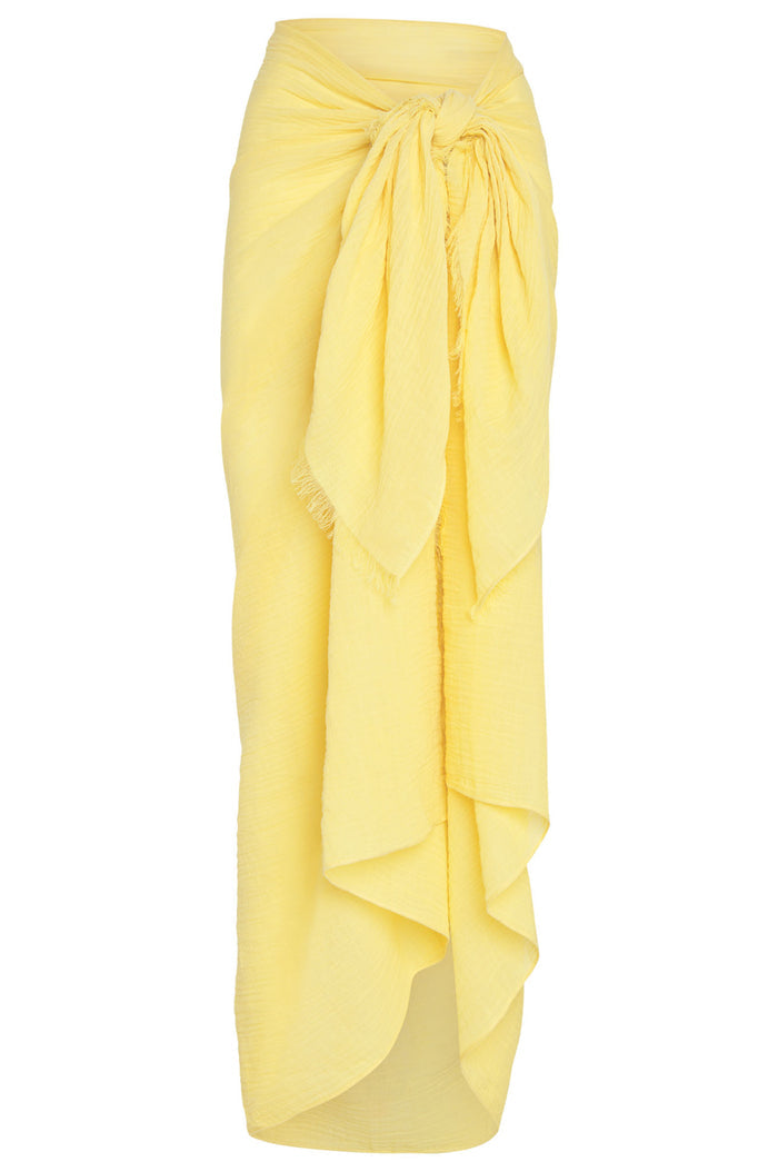 Front view of St. Tropez sarong in Meyer crinkle linen showing tied front knot, raw frayed edge and semi-sheer yellow fabric on white background