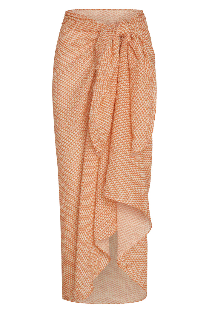Front view of St. Tropez sarong in peach micro-geo crinkle linen showcasing side knot and draped ruffle on white background