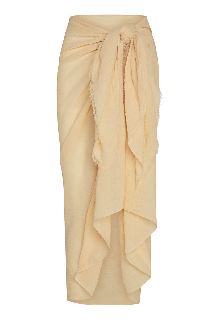 Front view of St. Tropez sarong in raffia crinkle linen showcasing tied side knot and cascading ruffle on white background