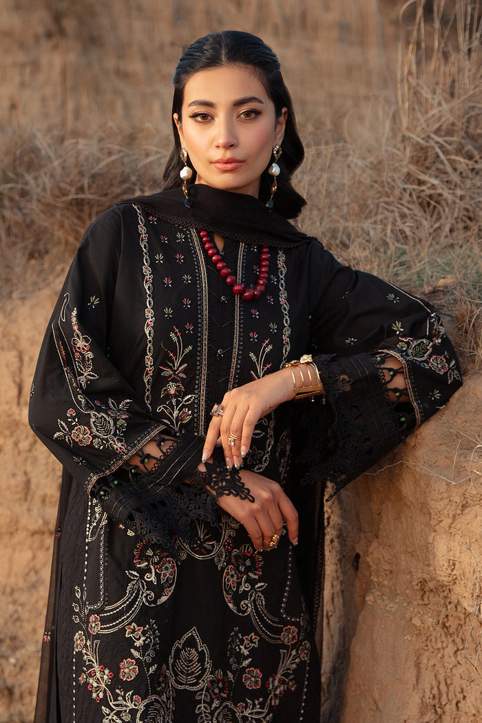 Close view of embroidered sleeves with bead finishing and lace cuff on black ready to wear women occasion outfit