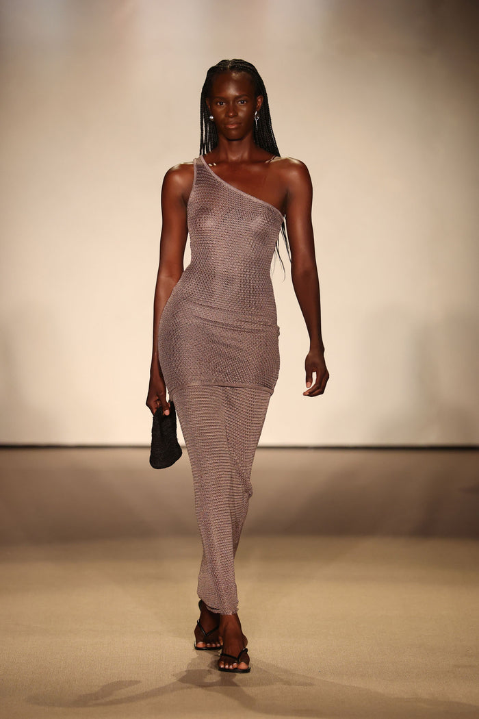 Front view of Taormina Dress in Steel Treble Knit on model showcasing one-shoulder neckline and asymmetrical mini hem on runway