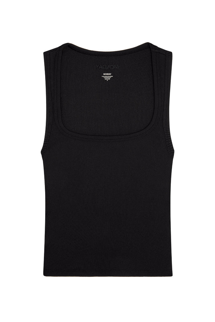Front view of Tash Tank Long in black rib showing wide square neckline and thin ribbed texture on white background