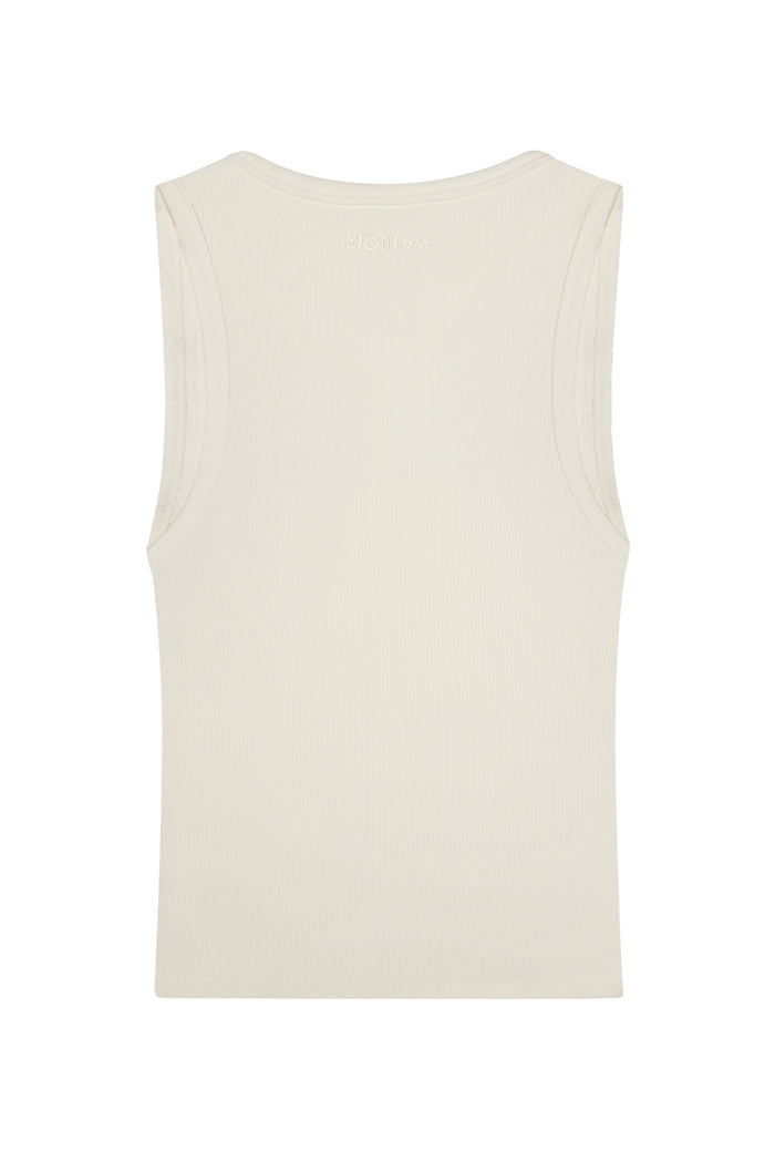 Back of Tash Tank Long in Ivory Rib showing ribbed fabric and MONDAY embroidery at upper back on white background