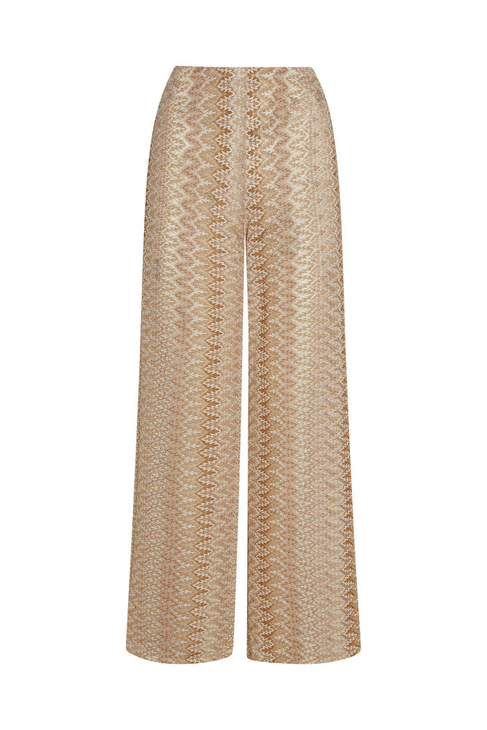Front view of Toulon Pant in Porto Cervo Gold showcasing fitted crochet knit and sheer zigzag pattern on white background